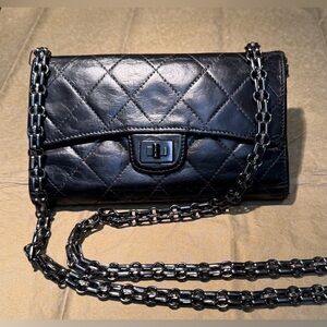 Chanel 2.55 Matelasse Long Wallet Black with an added unbranded crossbody chain.
